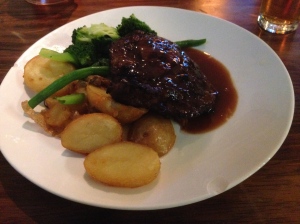 Scotch fillet with rosemary potatoes, vegetables, and beef jus
